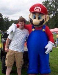 Nathaniel Guy posing with Mario.