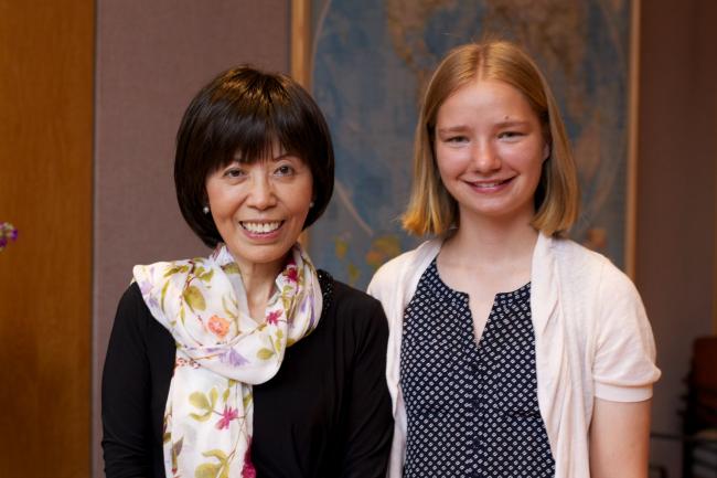 Professor Yu with a student.