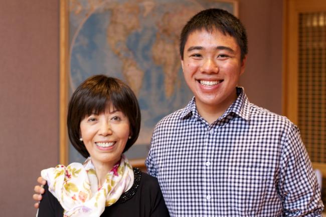 Professor Yu with a student.