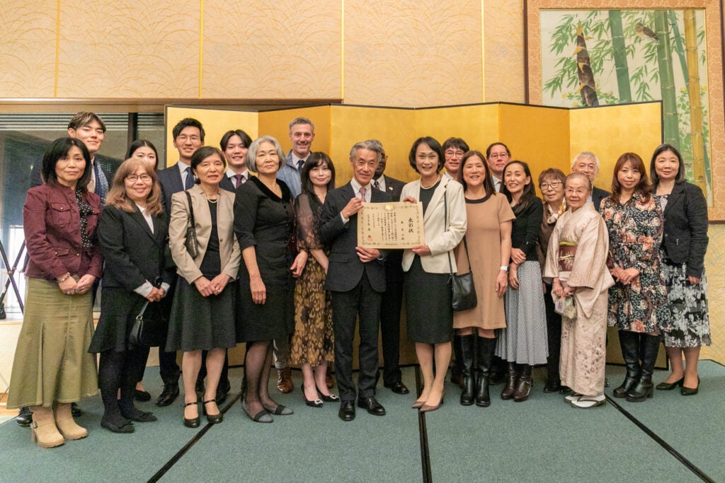Yoshiko Mori, with supporters, receives the Foreign Minister's Commendation
